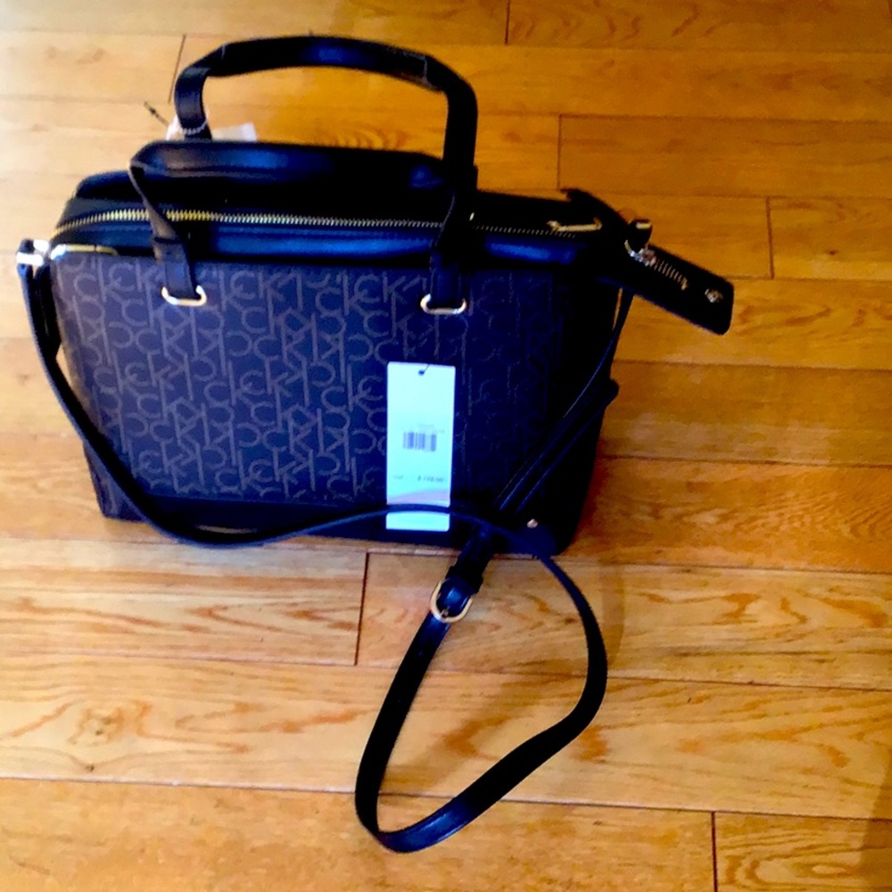 Brand new black Calvin Klein cross body purse.